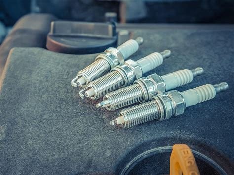 will new spark plugs improve gas mileage